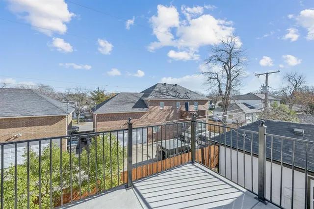 a view of a brick house with a large window