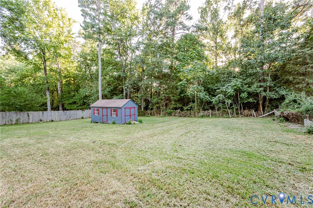 17530 Chemin Road Petersburg, VA 23803 - Photo 8 of 48 a backyard of a house with trees