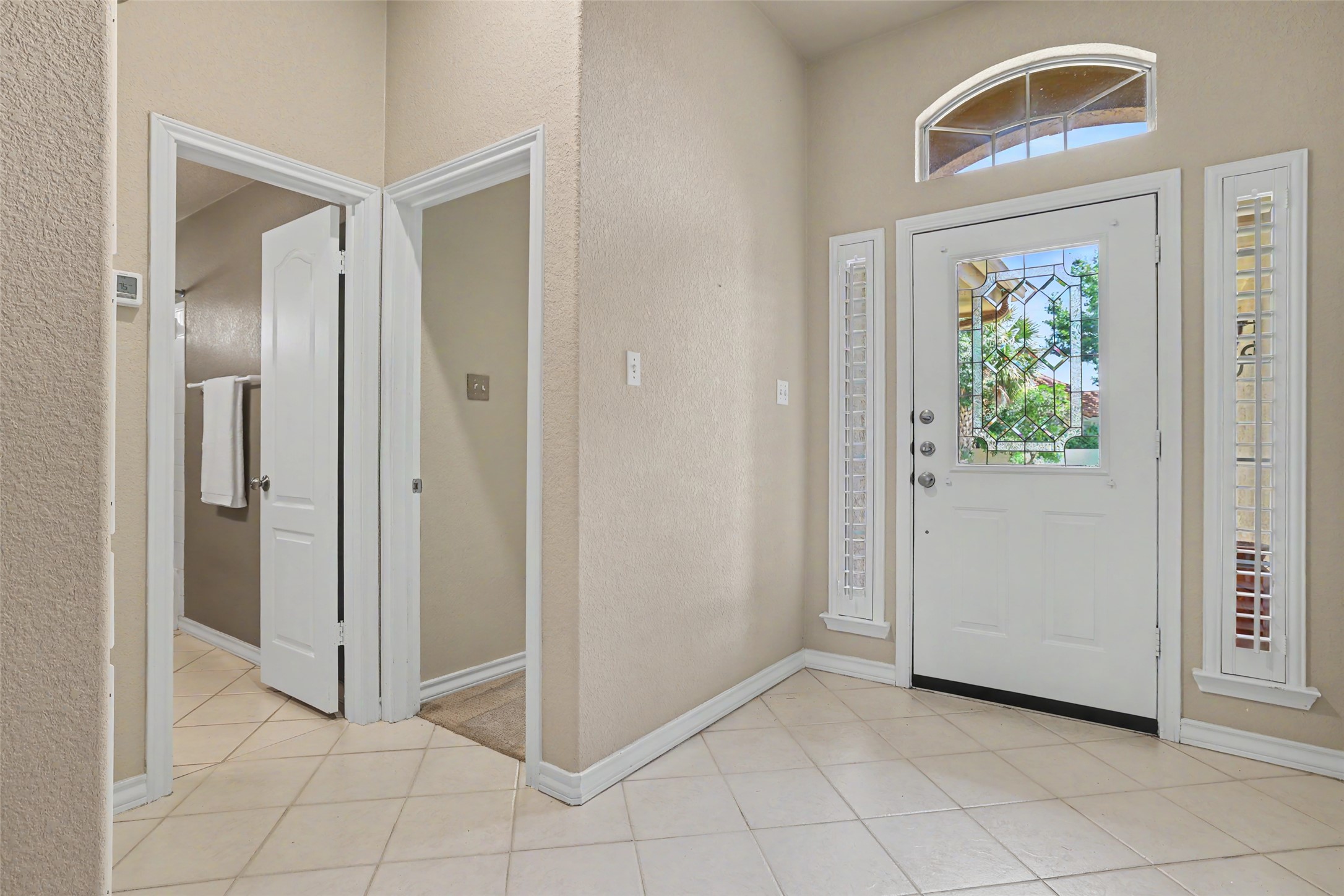 30107 Hamlet Circle Georgetown, TX 78628 - Photo 3 of 40 A welcoming entry features decorative glass accents and durable tile flooring.