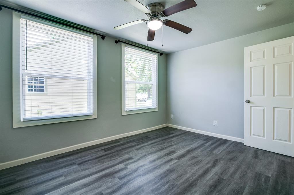 606 West High Street Terrell, TX 75160 - Photo 20 of 28 a view of an empty room with wooden floor and a window