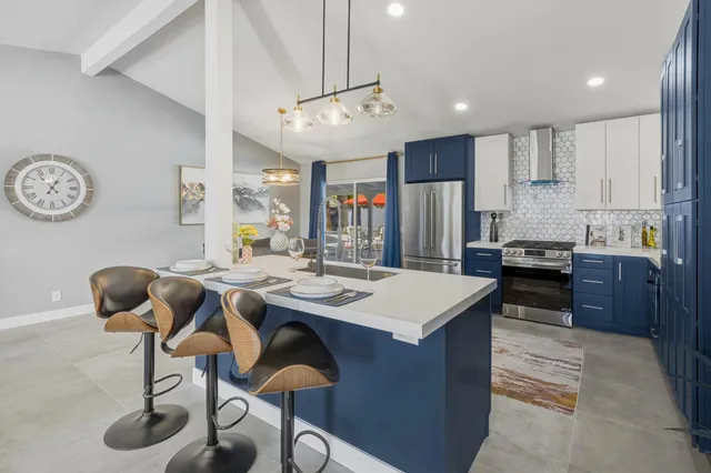 a kitchen with a table and chairs in it
