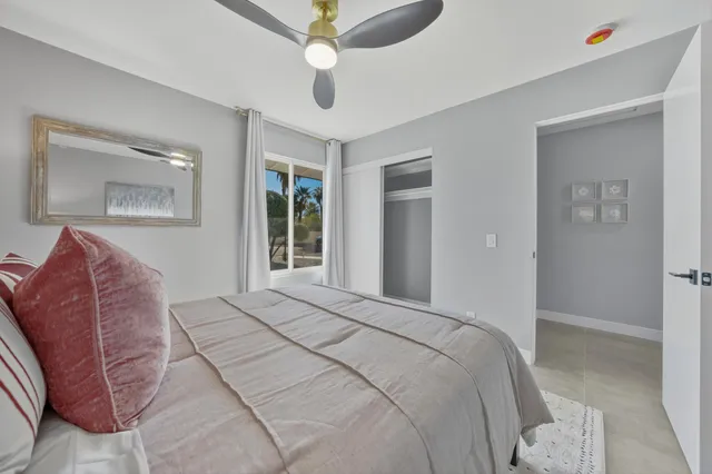 a bed room with a bed and a couch