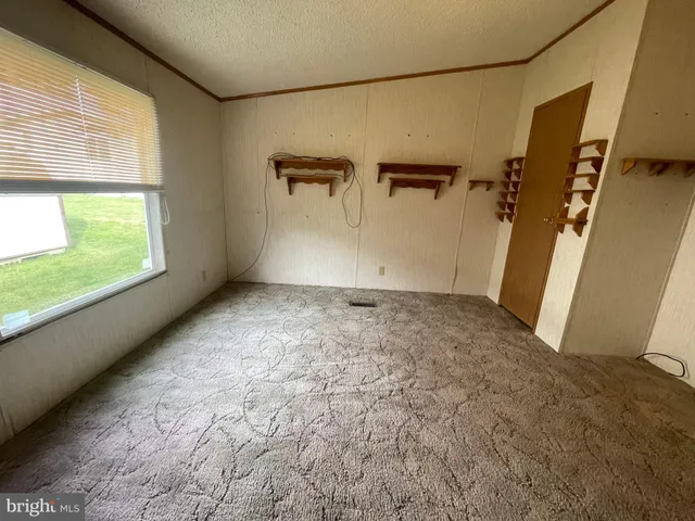 a view of empty room with windows