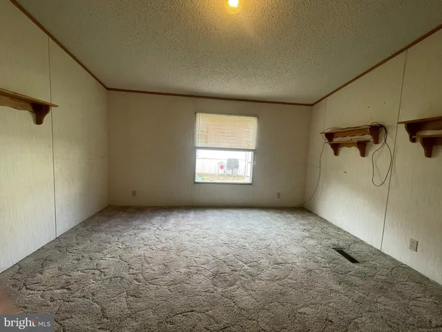 a view of a big room with windows