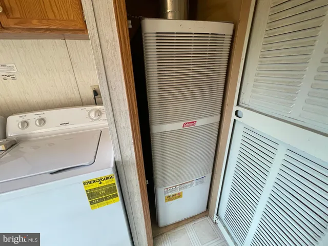 a view of a door and chair in a kitchen