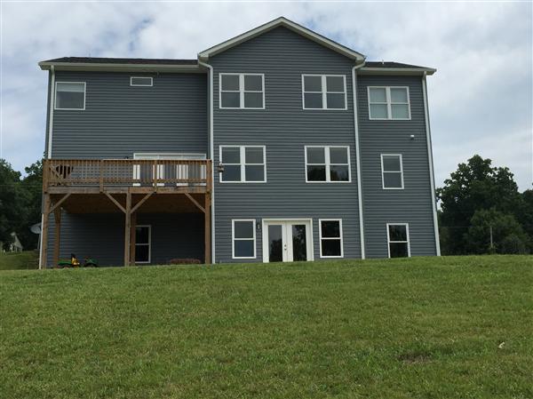 2095 Blue Ridge Springs Road Blue Ridge, VA 24064 - Photo 3 of 25 a front view of a house with a garden