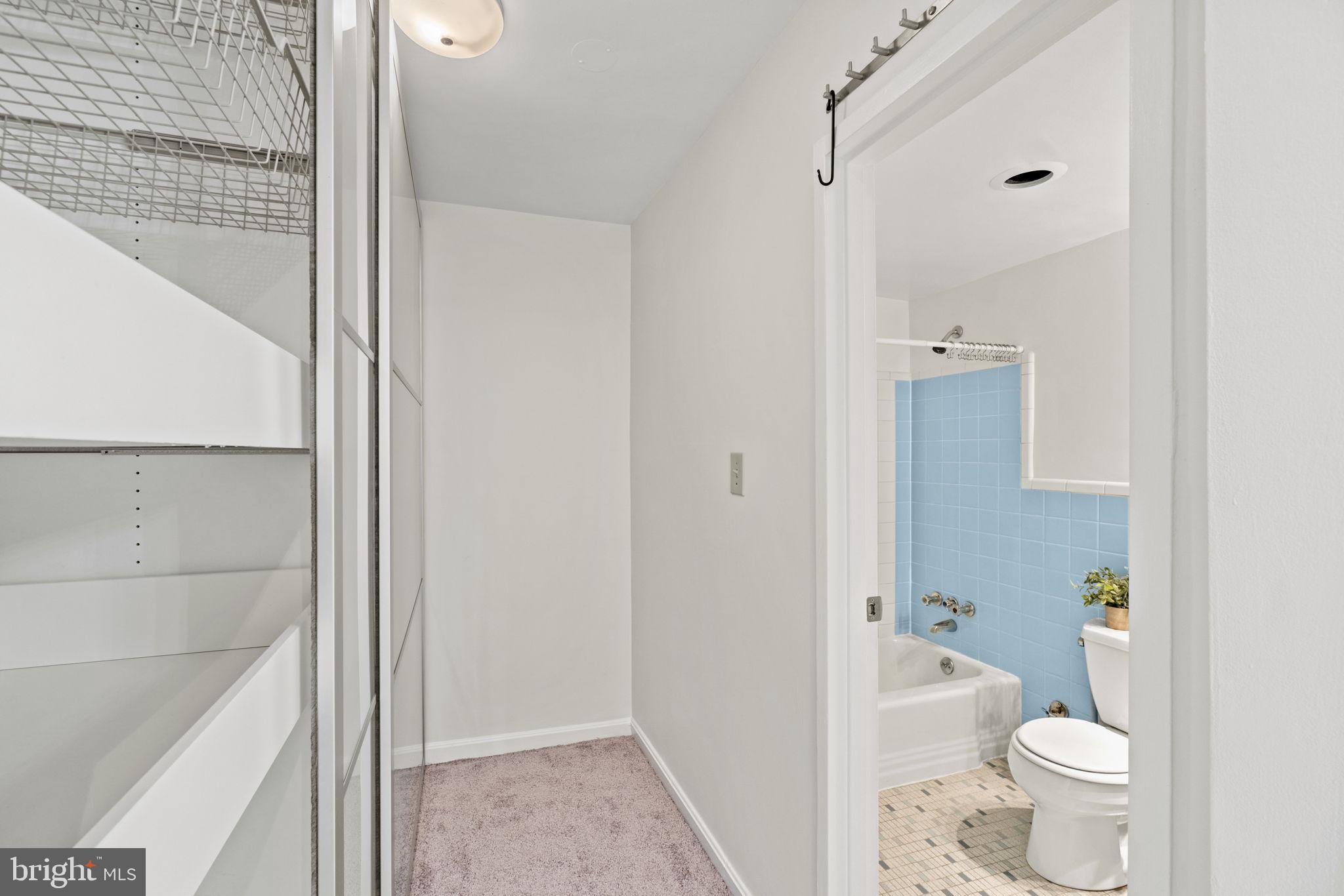 2710 Macomb Street Northwest, Unit 302 Washington, DC 20008 - Photo 14 of 19 Enter the bathroom from the closet too!