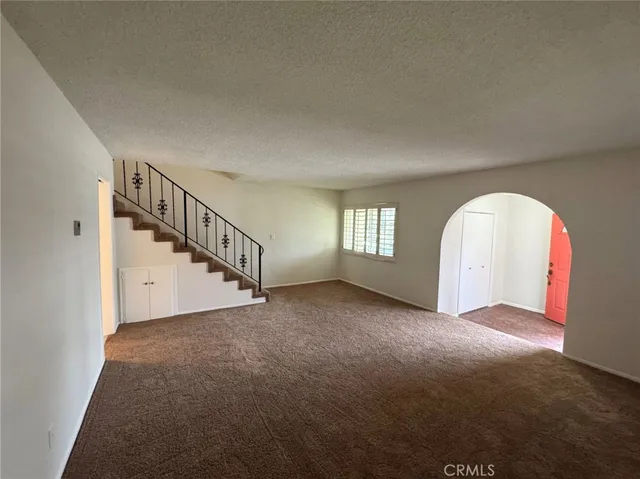 a view of a livingroom with a staircase