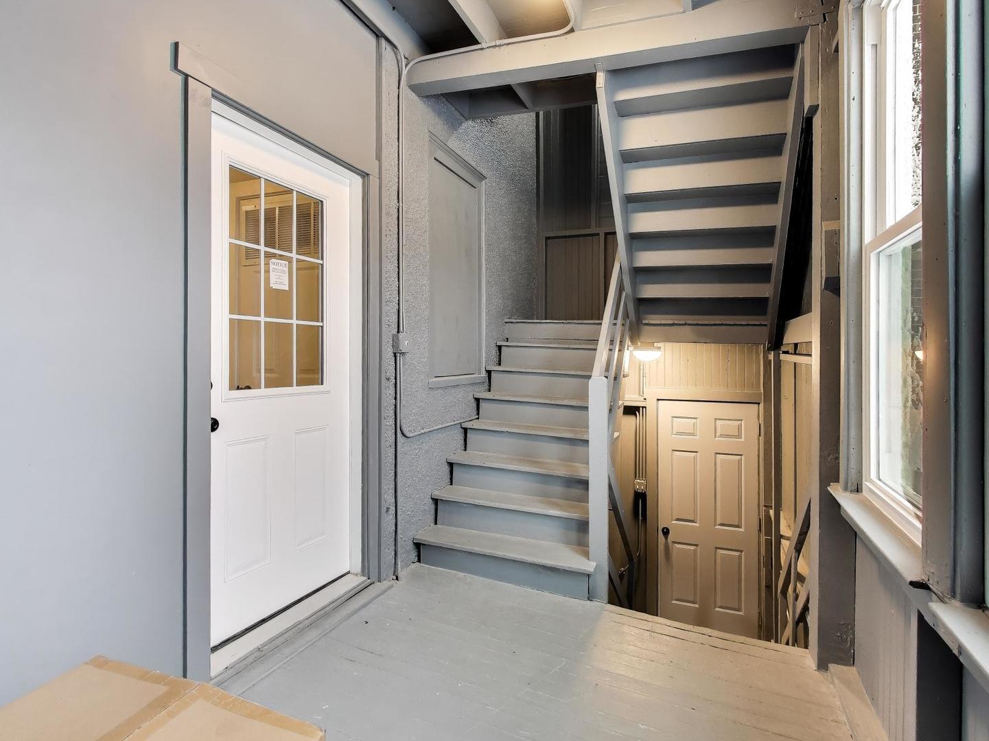 4213 West Roscoe Street, Unit 1 Chicago, IL 60641 - Photo 12 of 15 a view of walk in closet with empty racks