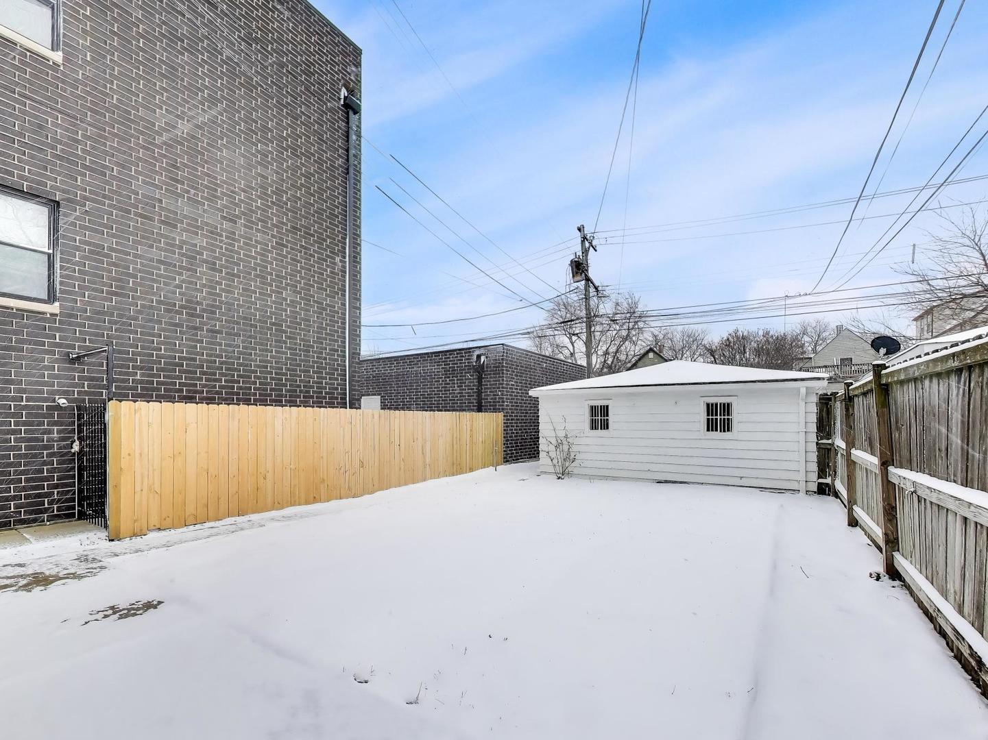 4213 West Roscoe Street, Unit 1 Chicago, IL 60641 - Photo 14 of 15 a view of a house with a outdoor space