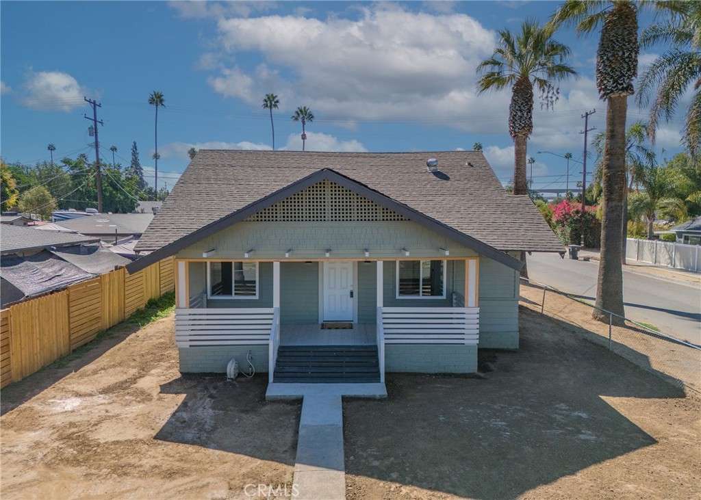 1974 Milton Street Riverside, CA 92507 - Photo 1 of 1 a front view of a house with a yard