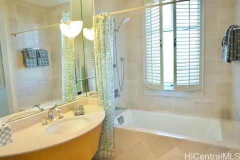 a kitchen with stainless steel appliances granite countertop a sink and a refrigerator