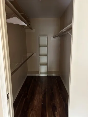 a view of an empty walk in closet