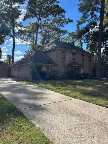 a house view with a backyard space