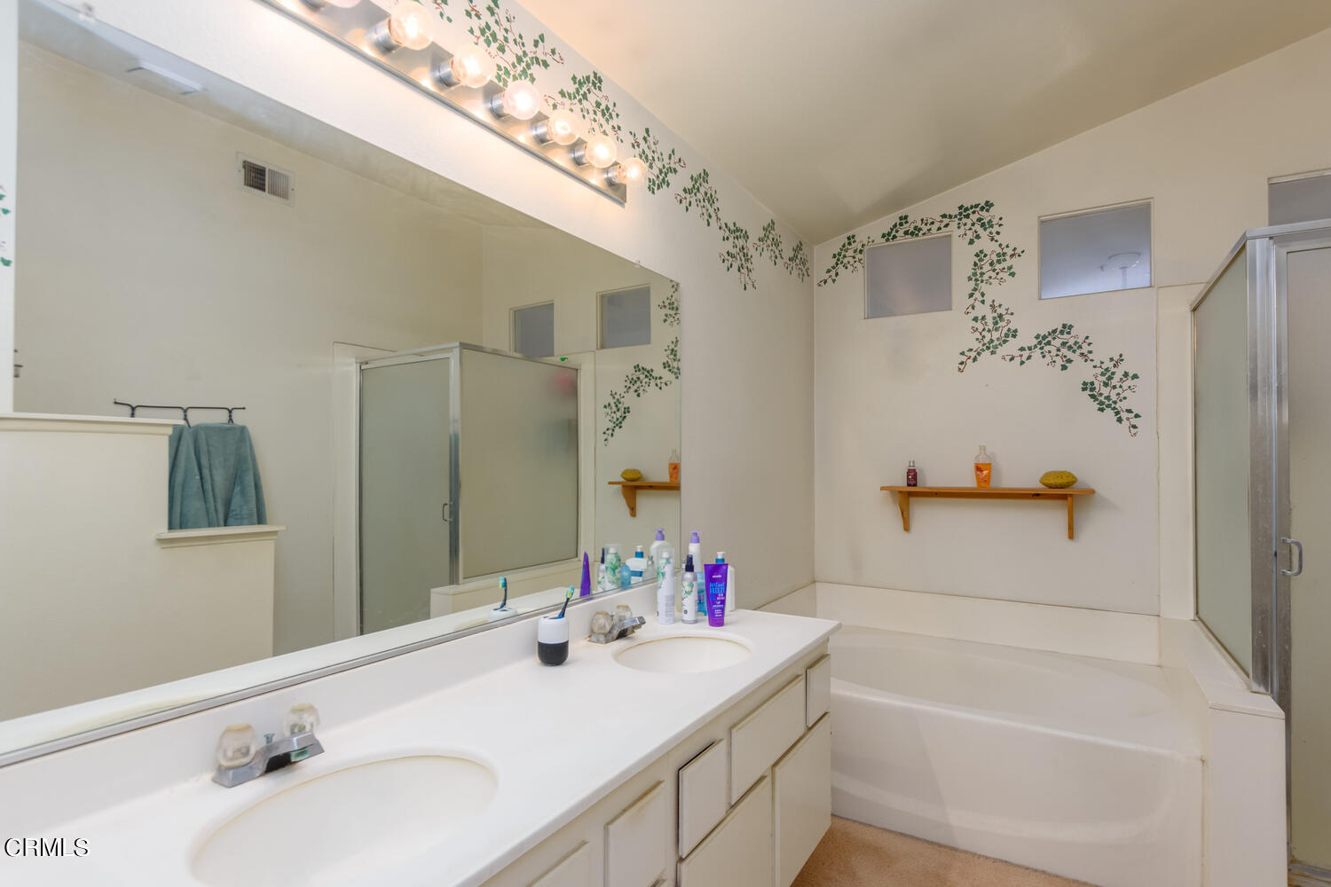 751 Kingfisher Way Oxnard, CA 93030 - Photo 16 of 22 a bathroom with a tub sink and mirror