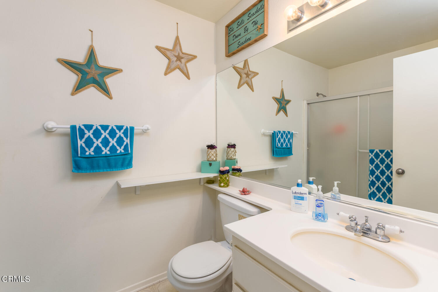 751 Kingfisher Way Oxnard, CA 93030 - Photo 18 of 22 a bathroom with a sink mirror and toilet