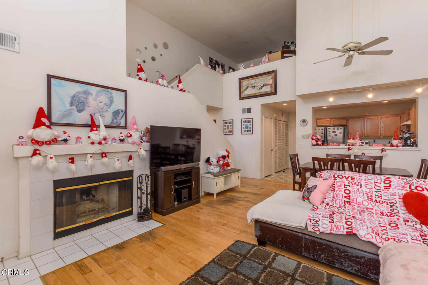 751 Kingfisher Way Oxnard, CA 93030 - Photo 4 of 22 a living room with furniture a flat screen tv and a fireplace