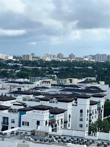 a balcony with chairs and a table
