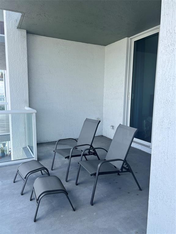 315 Northeast 3rd Avenue, Unit 1509 Fort Lauderdale, FL 33301 - Photo 19 of 40 a balcony with chairs and a table