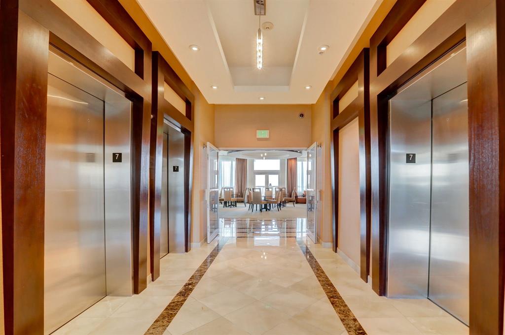 315 Northeast 3rd Avenue, Unit 1509 Fort Lauderdale, FL 33301 - Photo 25 of 40 a view of a hallway with couches and dinning table