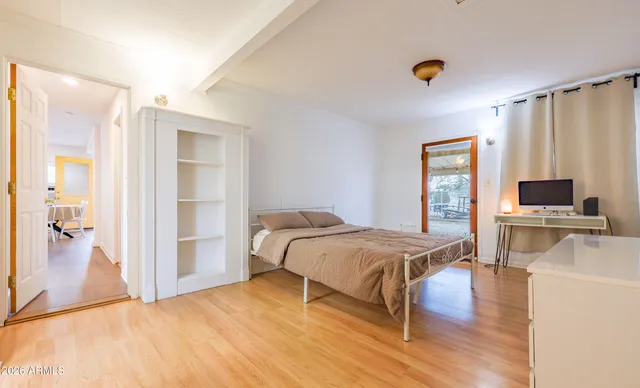 a bedroom with a bed and a table