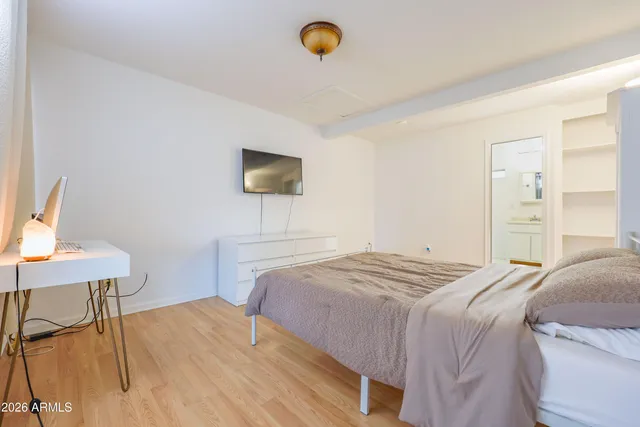 a white toilet sitting next to a bathroom sink