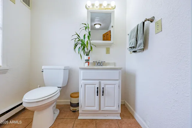 a view of a house with a yard and porch