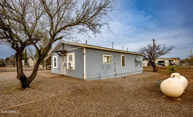 a view of a house with a balcony and stairs