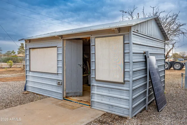 a view of living room with patio furniture and garden