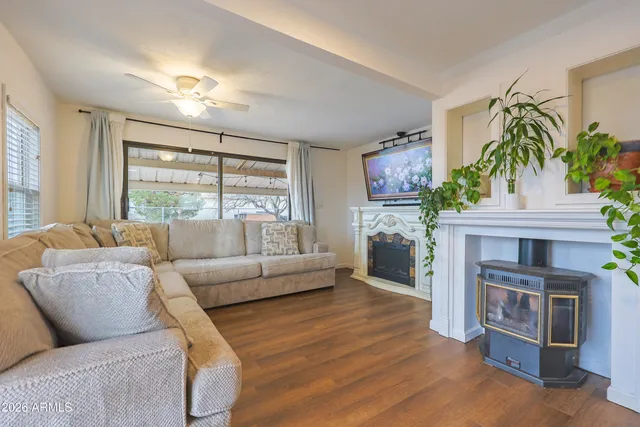 a living room with furniture and a fireplace