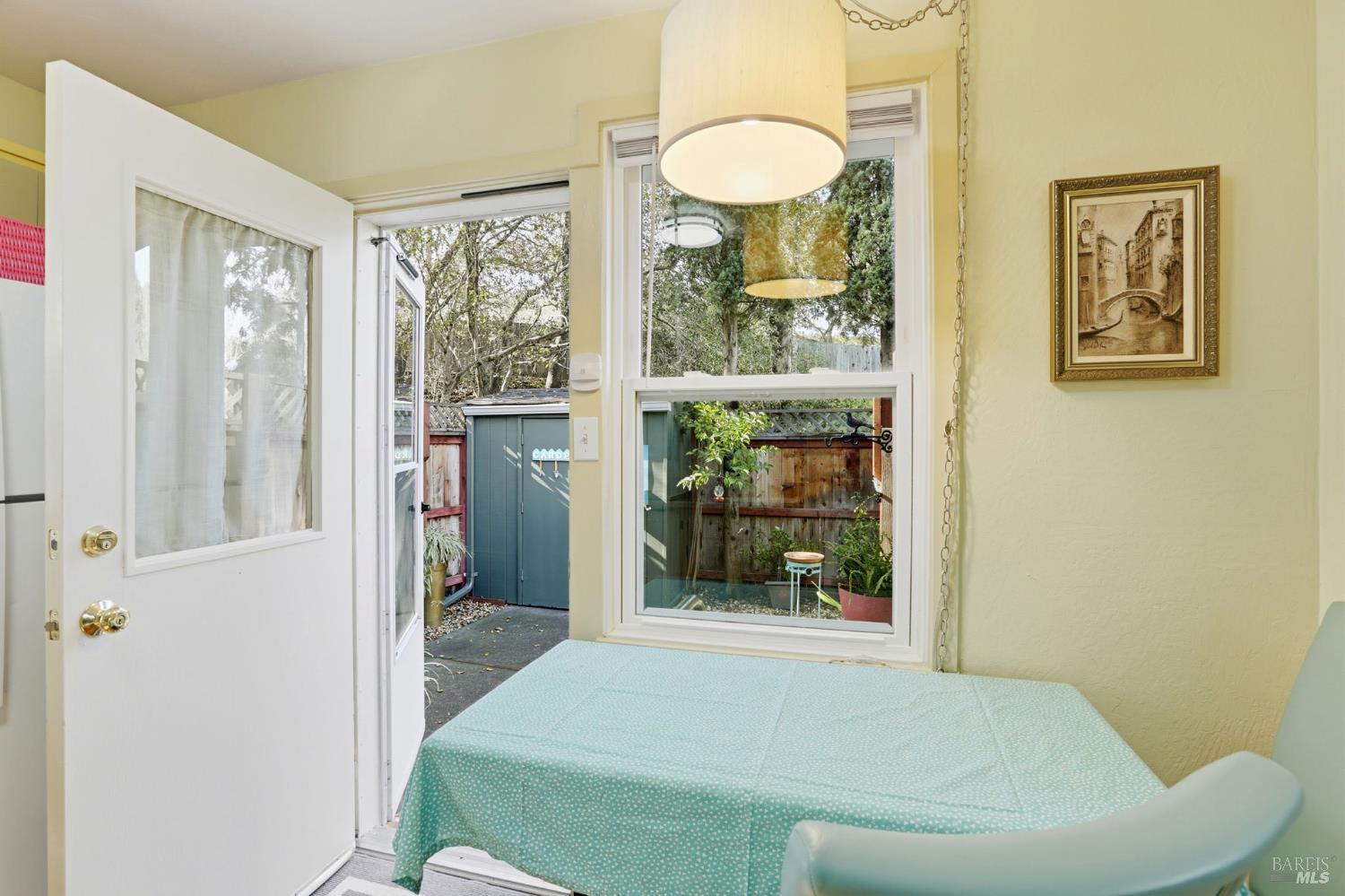 49 Livingston Court Novato, CA 94949 - Photo 9 of 21 view from table out to patio, read door with access to outdoor living and charming setting