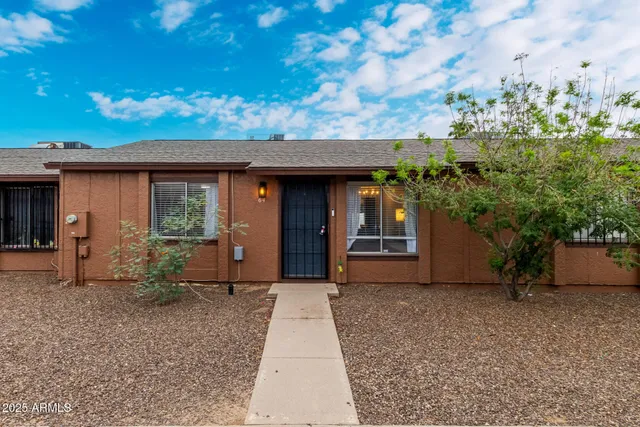 a view of a house with porch and sitting area