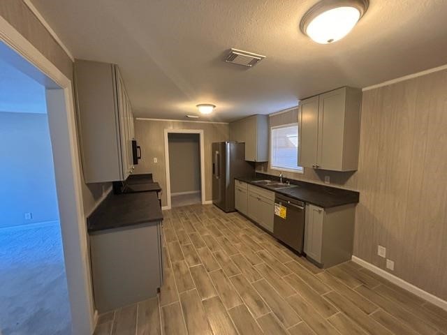 4420 Raven Street Beaumont, TX 77705 - Photo 4 of 11 a kitchen with granite countertop a sink and a stove top oven