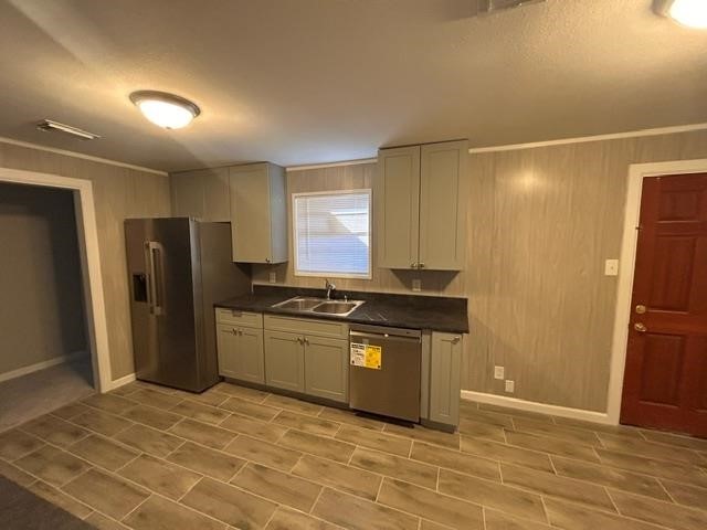 4420 Raven Street Beaumont, TX 77705 - Photo 5 of 11 a kitchen with stainless steel appliances granite countertop a refrigerator and a sink