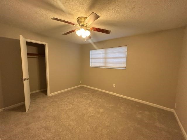 4420 Raven Street Beaumont, TX 77705 - Photo 8 of 11 an empty room with windows and fan