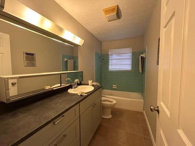 4420 Raven Street Beaumont, TX 77705 - Photo 10 of 11 a bathroom with a granite countertop sink toilet and shower
