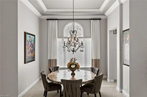 a view of a dining room with furniture window and chandelier
