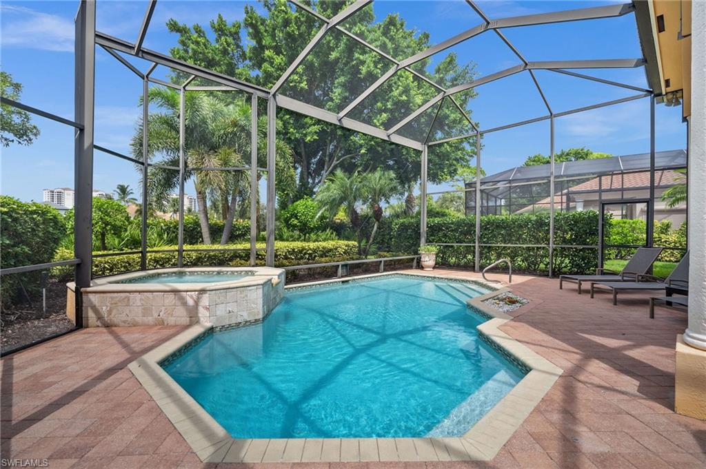 23841 Addison Pl Court Bonita Springs, FL 34134 - Photo 12 of 47 a view of a backyard with a swimming pool