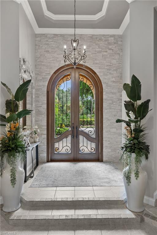 23841 Addison Pl Court Bonita Springs, FL 34134 - Photo 18 of 47 a vase of flowers sitting on a table