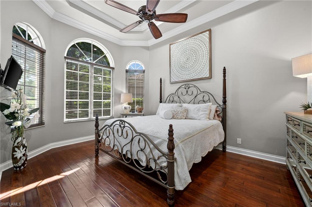 23841 Addison Pl Court Bonita Springs, FL 34134 - Photo 28 of 47 a bedroom with a bed mirror and window