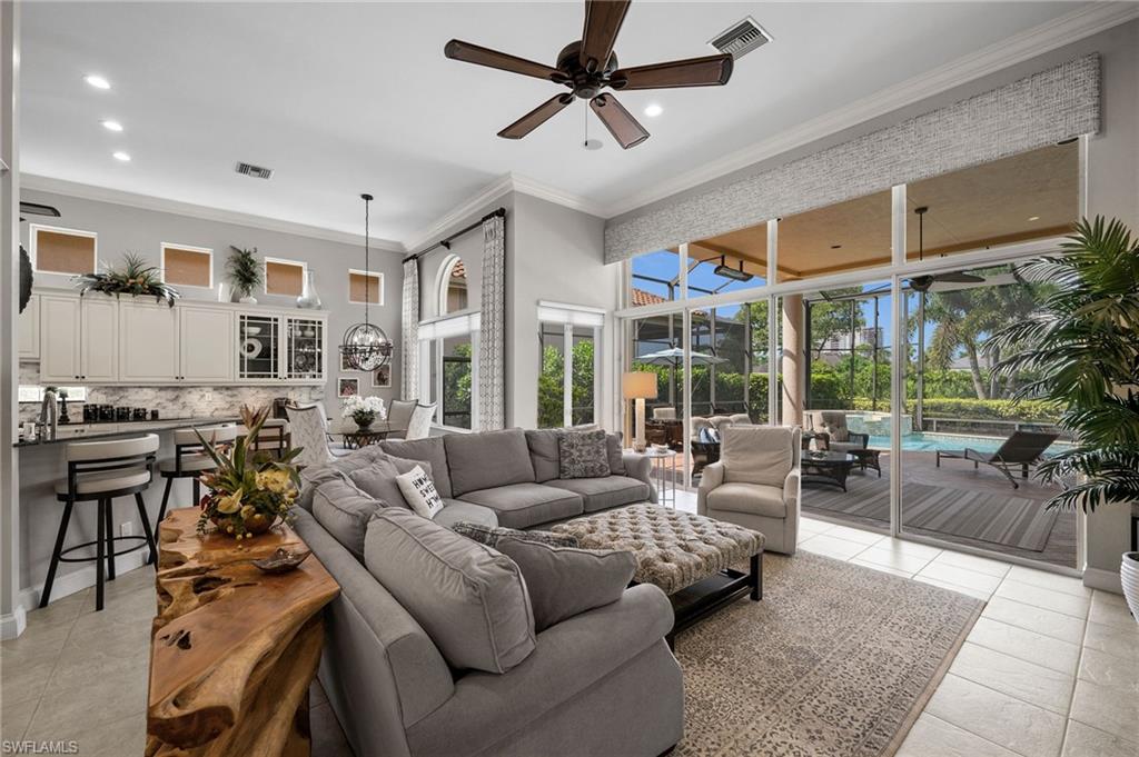 23841 Addison Pl Court Bonita Springs, FL 34134 - Photo 3 of 47 a living room with furniture and a large window