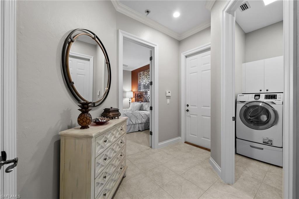 23841 Addison Pl Court Bonita Springs, FL 34134 - Photo 33 of 47 a room with a washing machine and a mirror