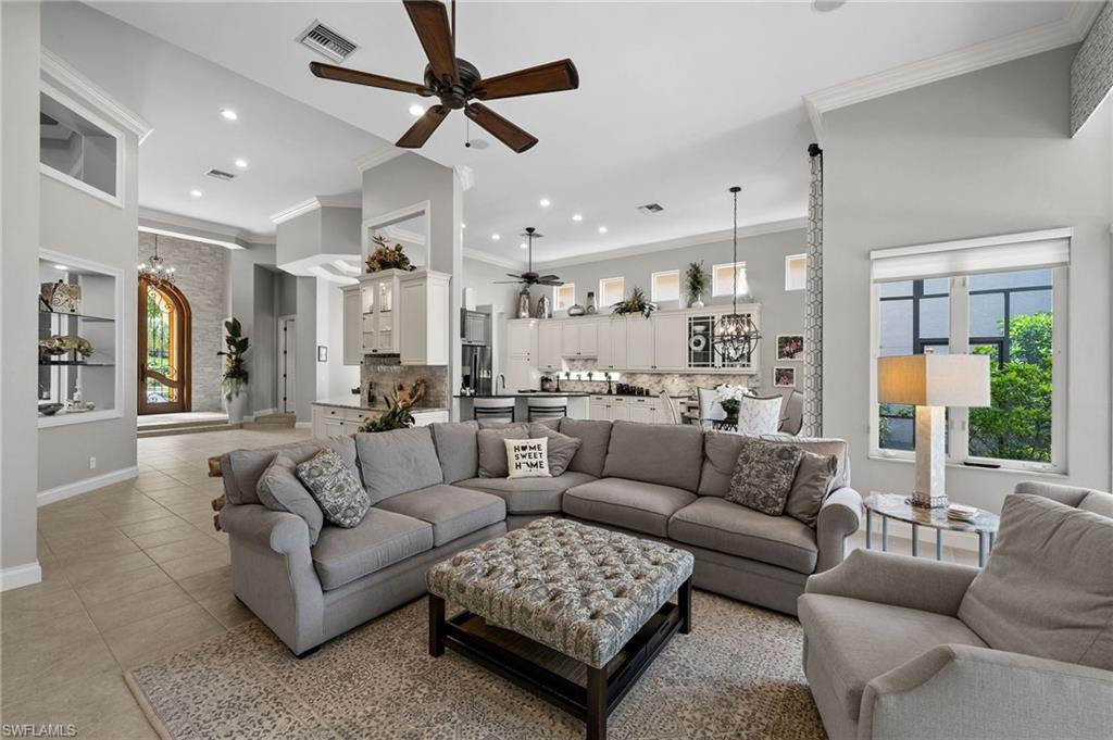 23841 Addison Pl Court Bonita Springs, FL 34134 - Photo 5 of 47 a living room with furniture and a view of kitchen