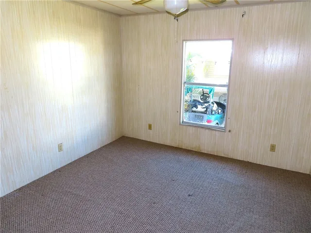 a view of a room that has a window in it