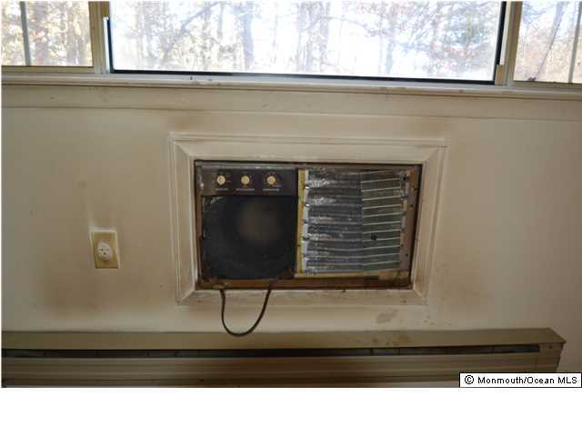 155D Sunset Road, Unit C Whiting, NJ 08759 - Photo 4 of 11 a black and white photo of a fireplace