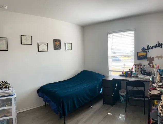 a room with a bed and a table in it