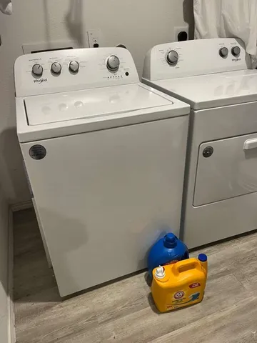 a utility room with dryer and washer