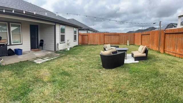 a kitchen with a table and chairs in it