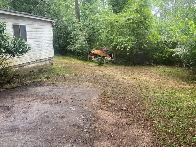 a backyard of a house with lots of green space