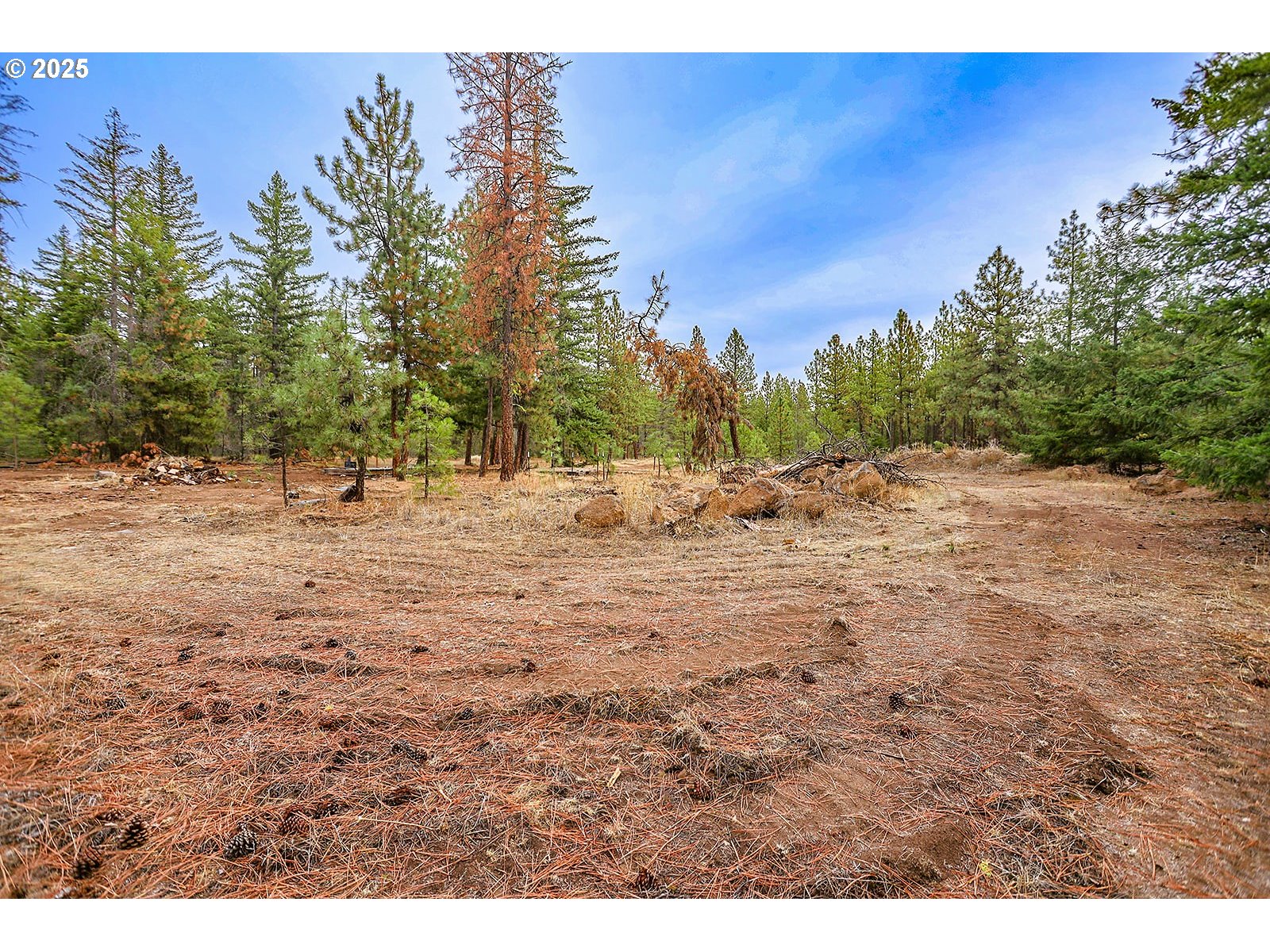 68 Matola Road Goldendale, WA 98620 - Photo 16 of 36 a view of dirt road with a building in the background